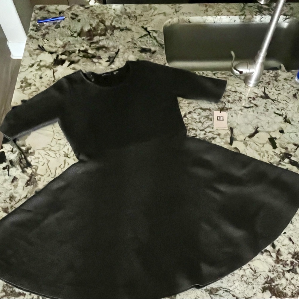 Ivanka Trump black/grayish dress.